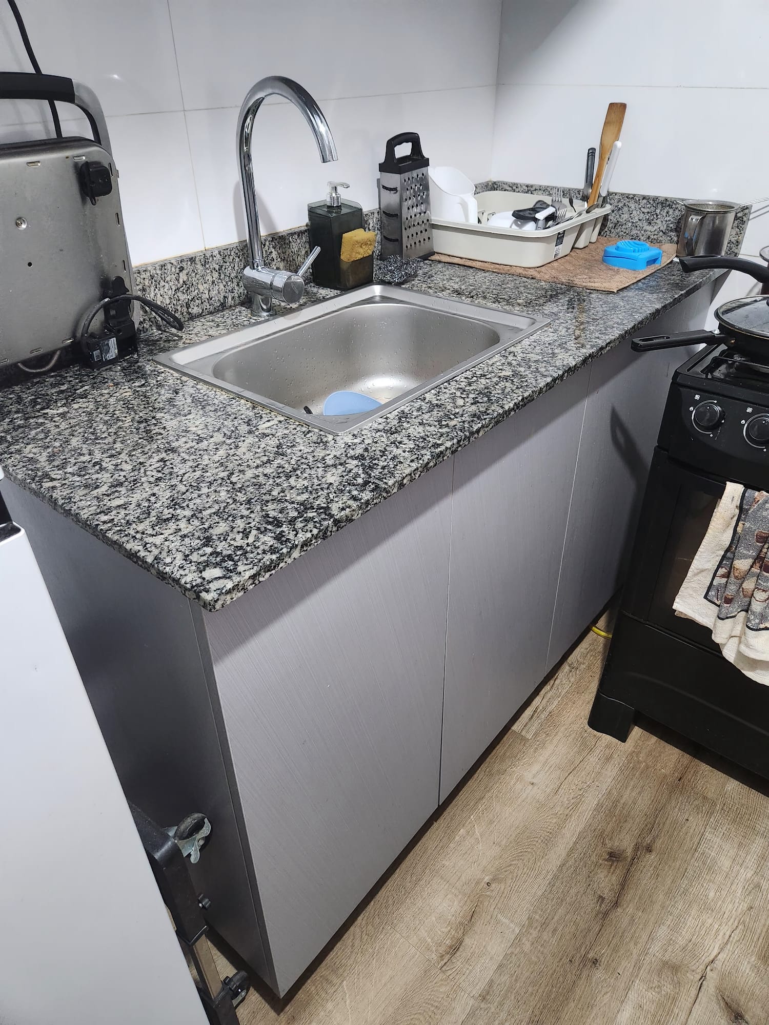 Current kitchen before remodel, view three